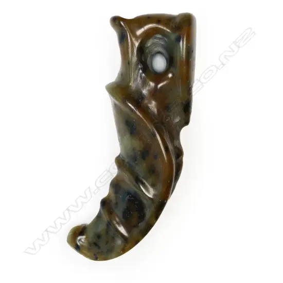 A rare Māori pounamu (serpentine) rei puta pendant,